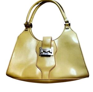 Mondani New York Yellow leather bag with pink trim.